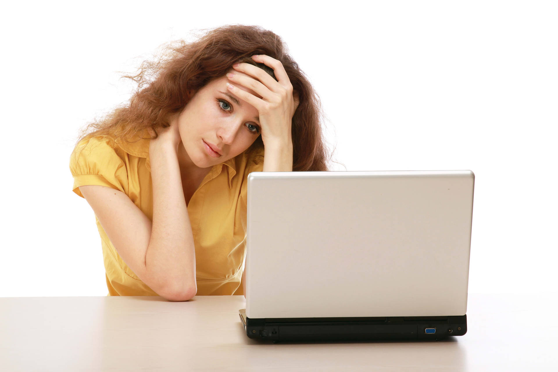 Uninspired Young Woman Staring Pensively At Laptop Screen Background