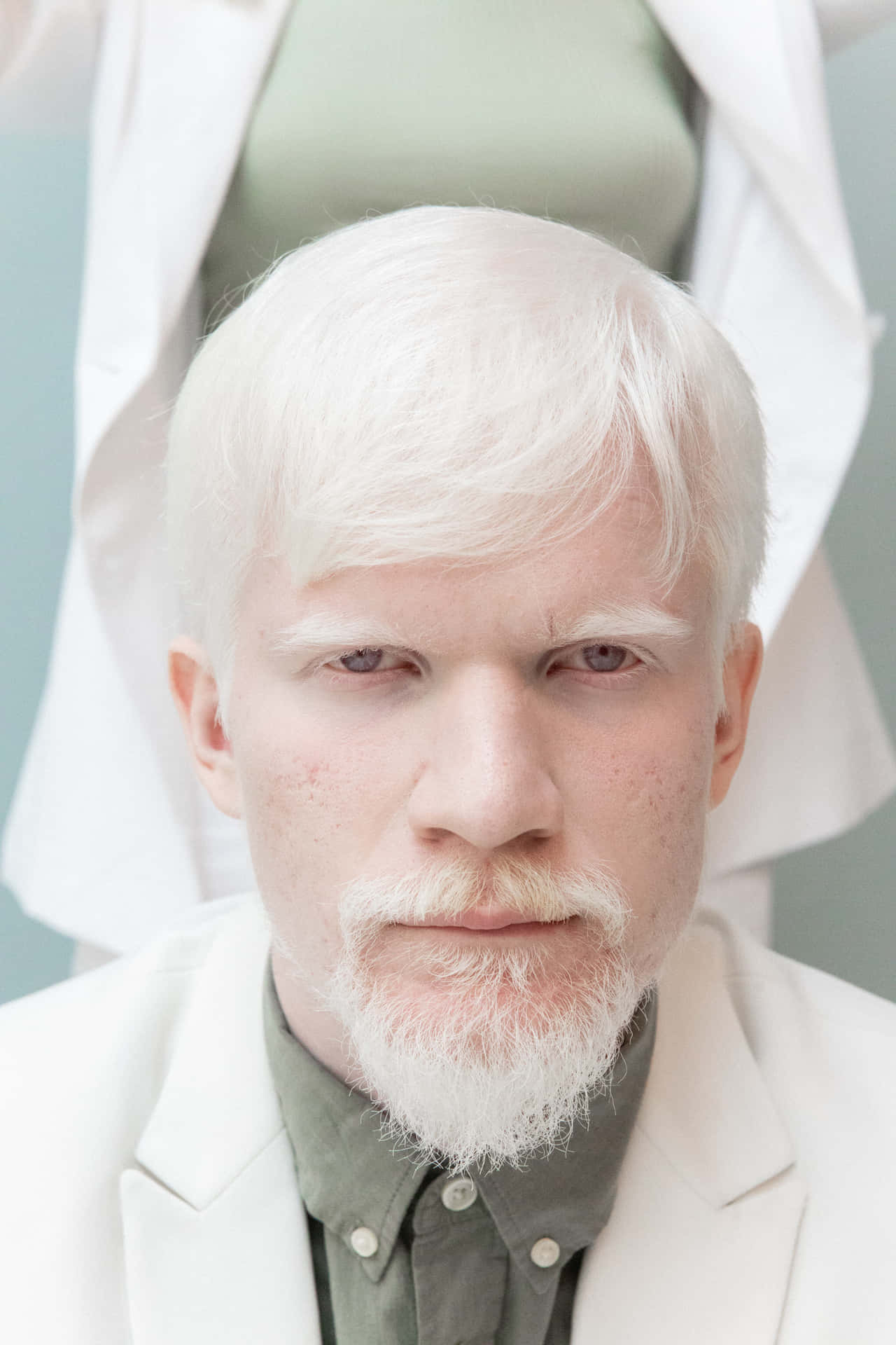 Unique Portrait Of A Man With Striking White Hair Background