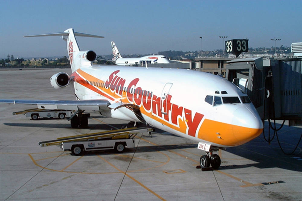 Unique Sun Country Boeing 727 At Tarmac Background