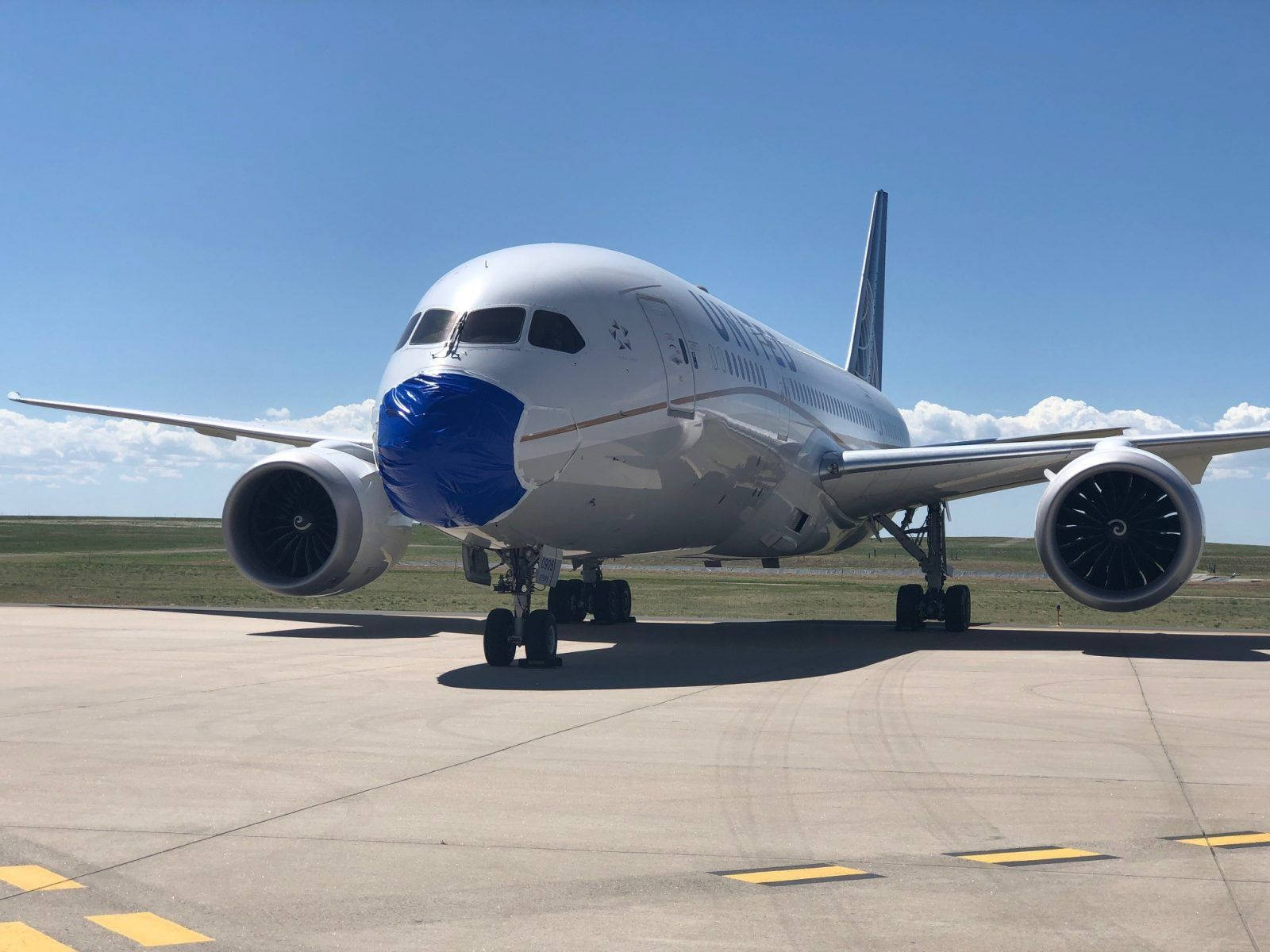 United Airlines Plane Parked At Flight Ramp Background