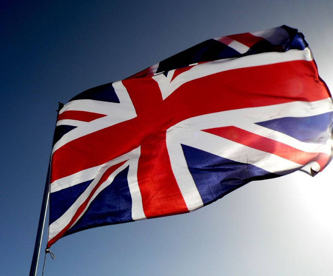 United Kingdom Flag With Blue Sky Background