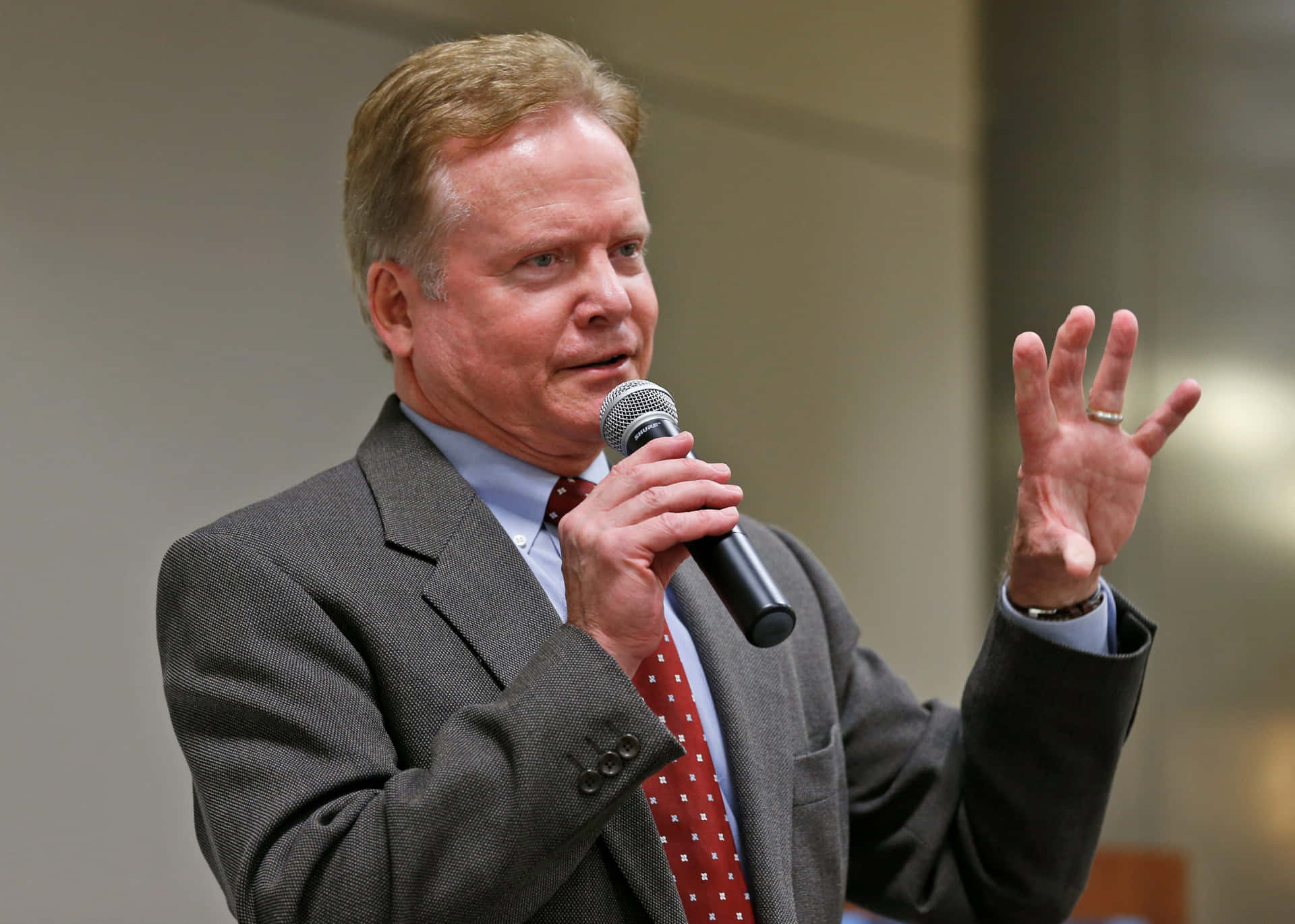 United States Senator Jim Webb, With One Hand Raised Background