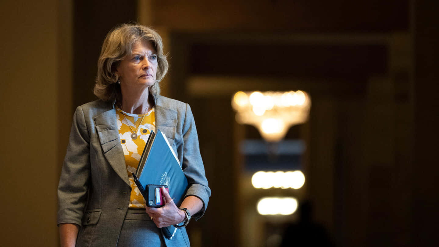 United States Senator Lisa Murkowski Walking In A Hallway Background