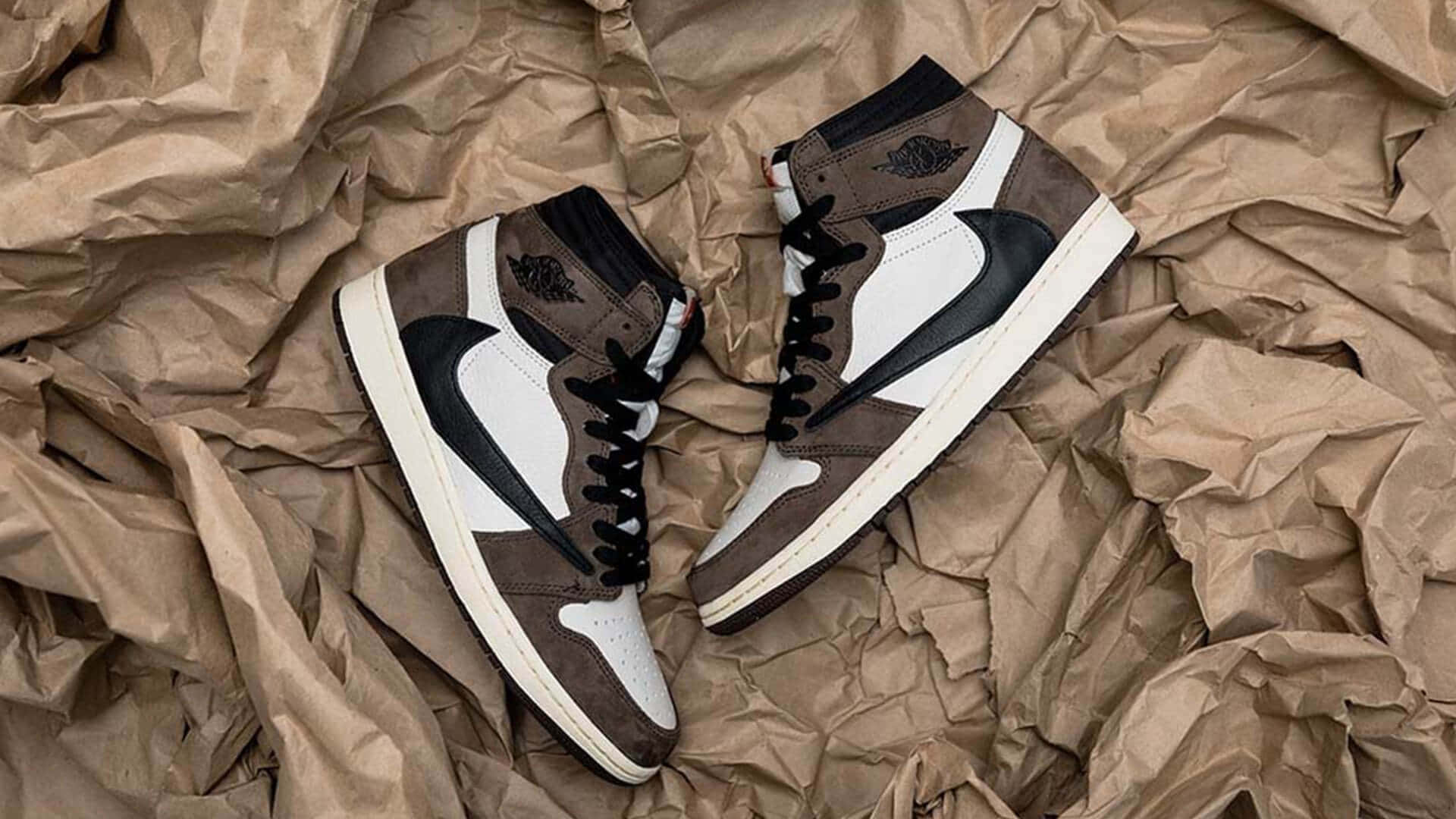 Uniting Music And Style - A Look At Travis Scott's Jordan 1 Sneakers Background