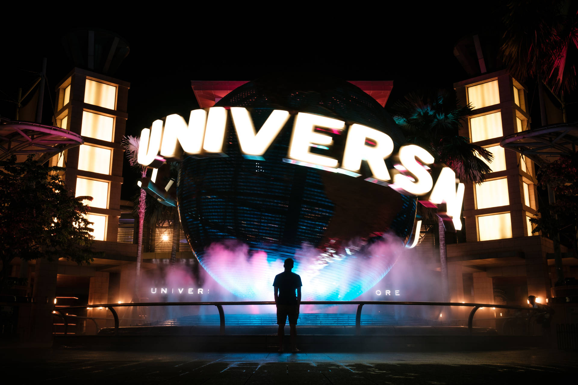 Universal Studios Globe In The Dark Background