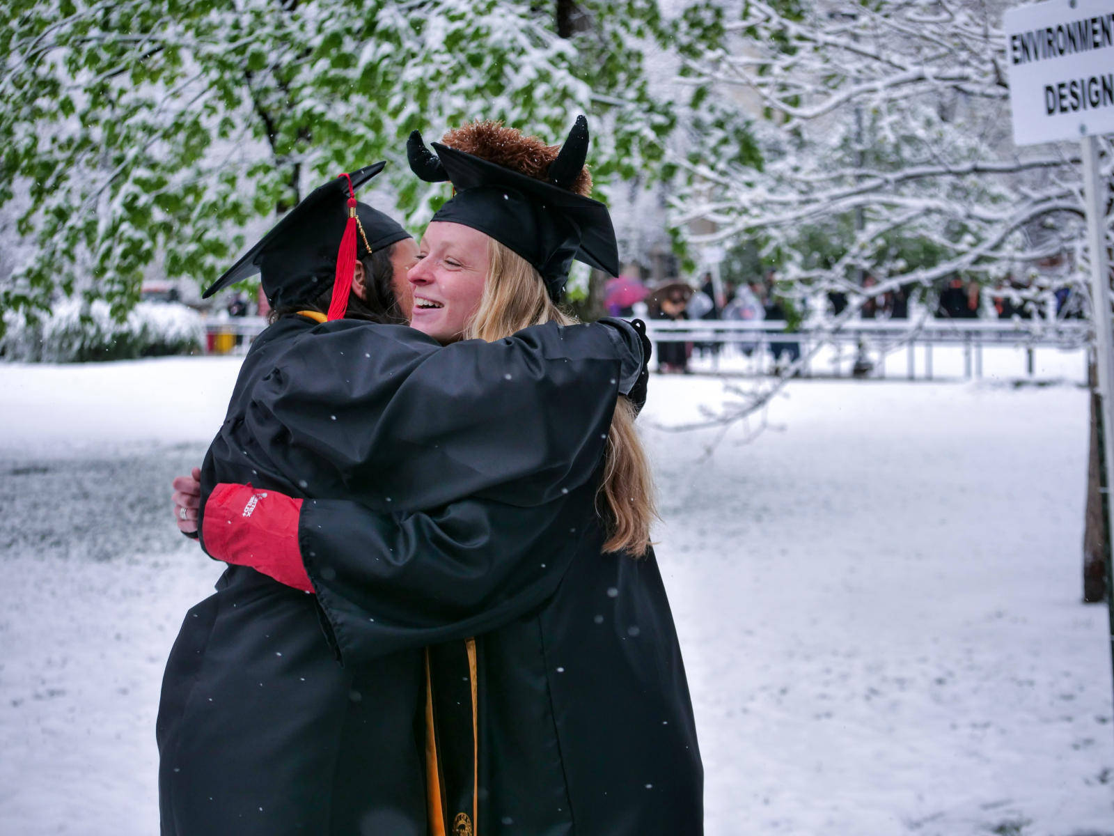 University Of Colorado At Boulder Graduates Hugging Background