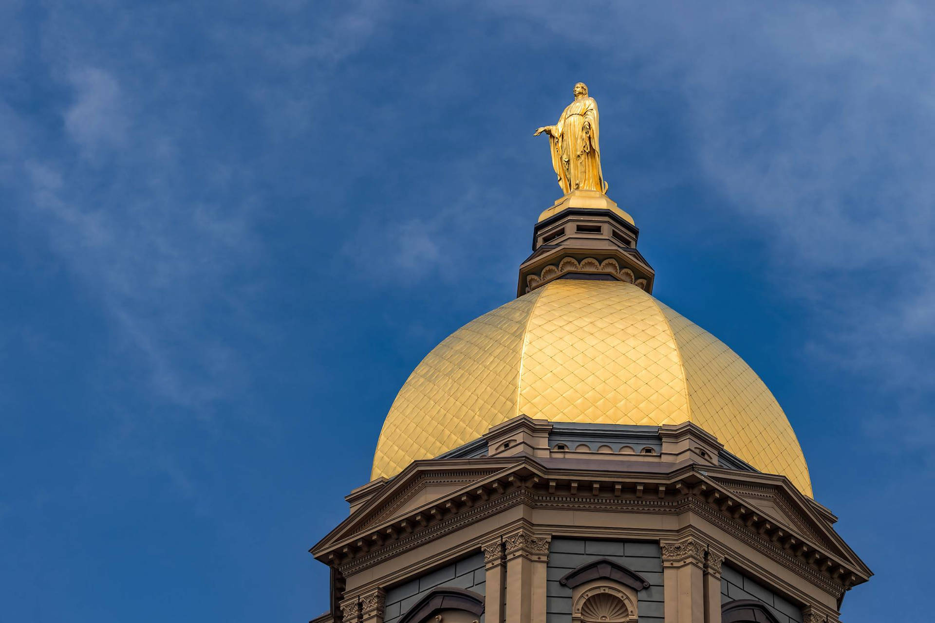 University Of Notre Dame Dome Under Blue Sky Background