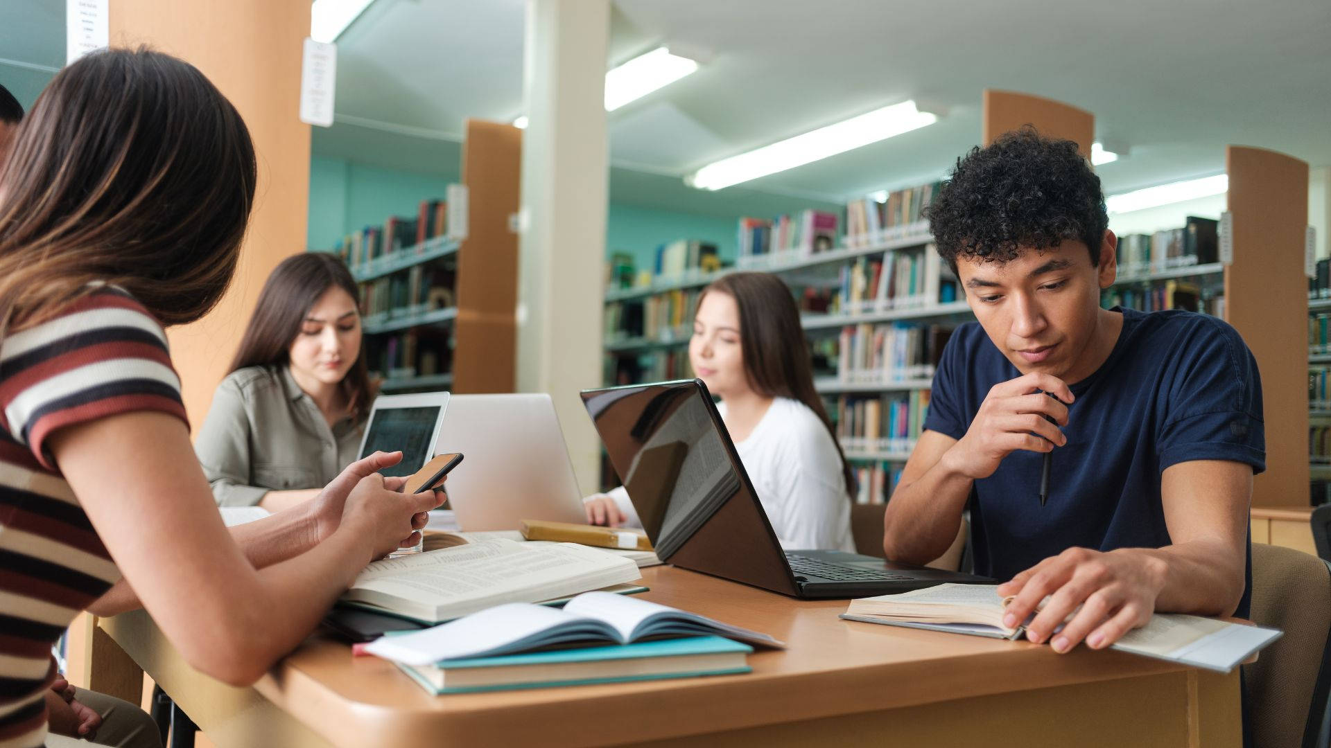 University Scholar Engrossed In Study Background