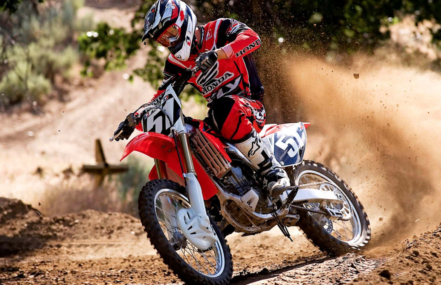 Unleash Your Inner Passion And Explore The Trails Using A Honda Dirt Bike. Background