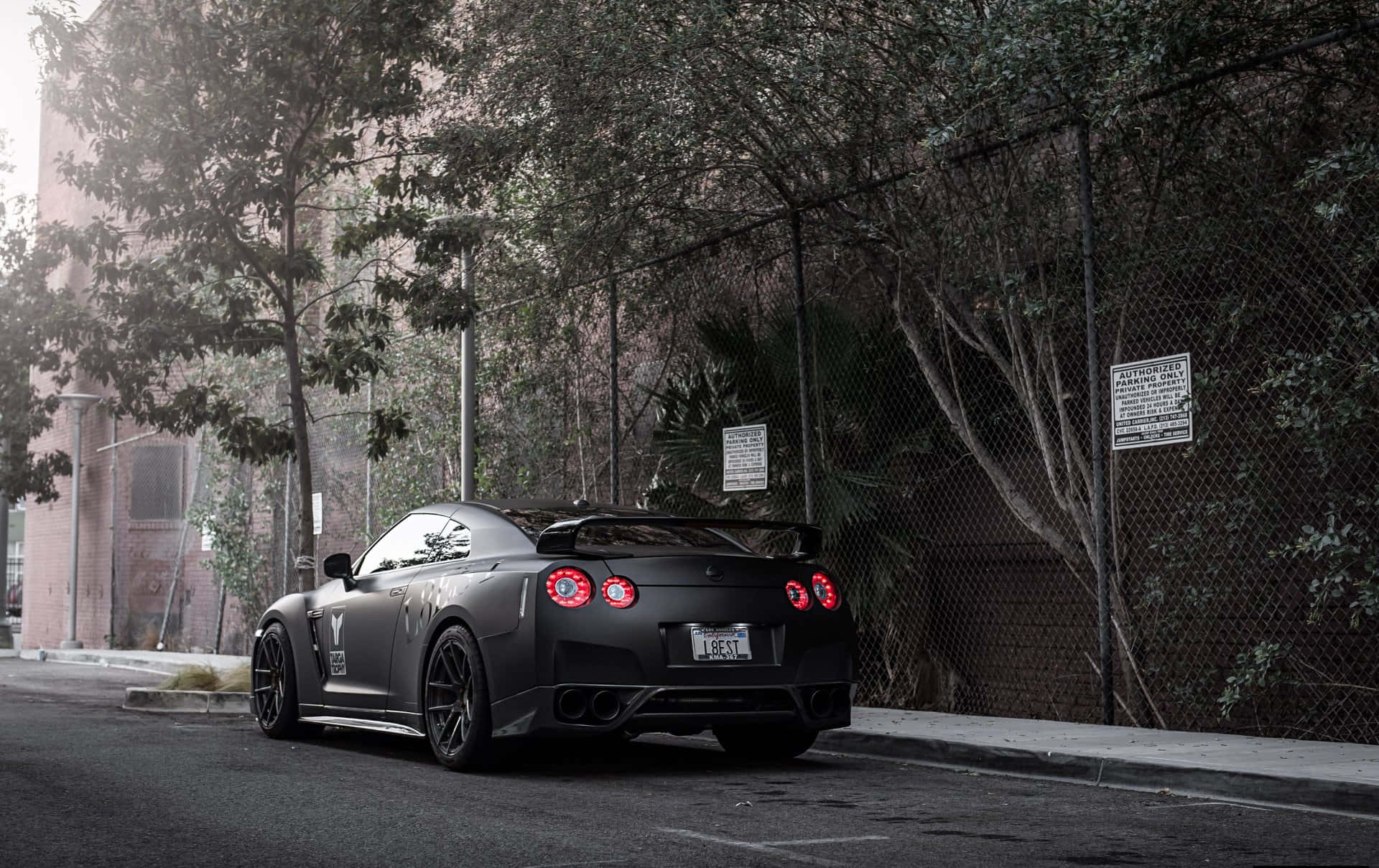 Unleashing Power - Matte Black Nissan R35 Gtr Background