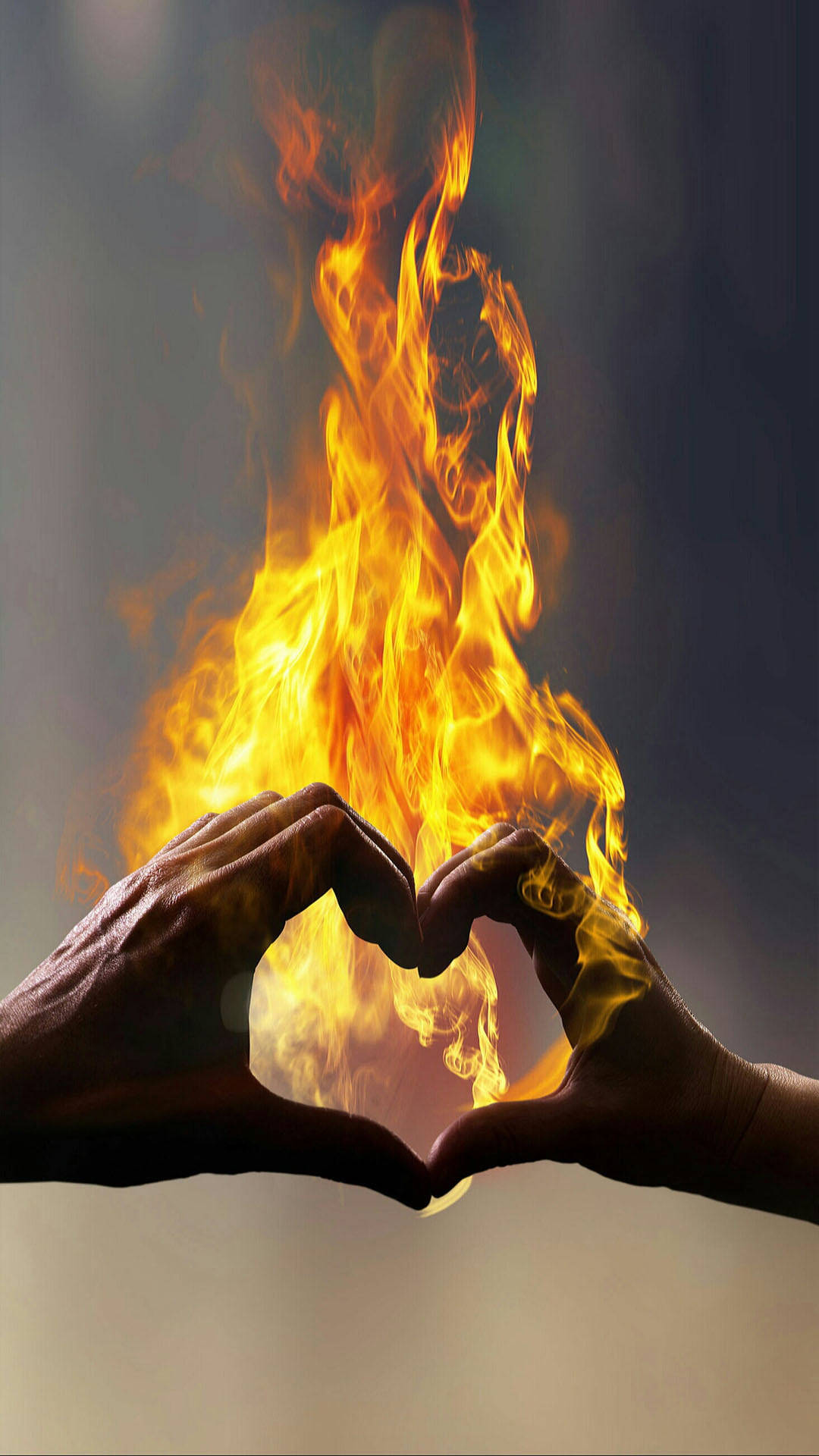 Unleashing The Power Of Love: A Fiery Finger Heart Gesture