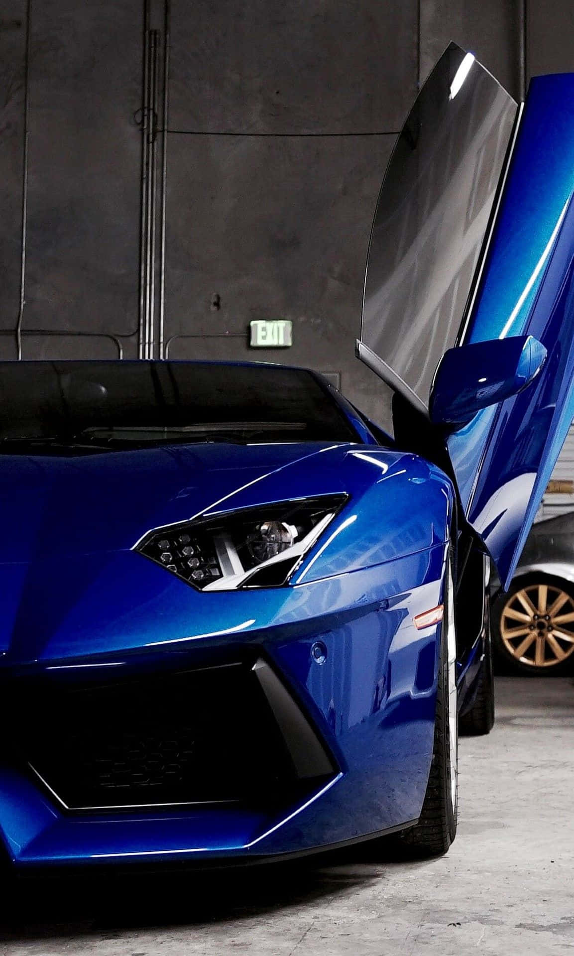 Unlock The Power Of This Bright Blue Lamborghini Background