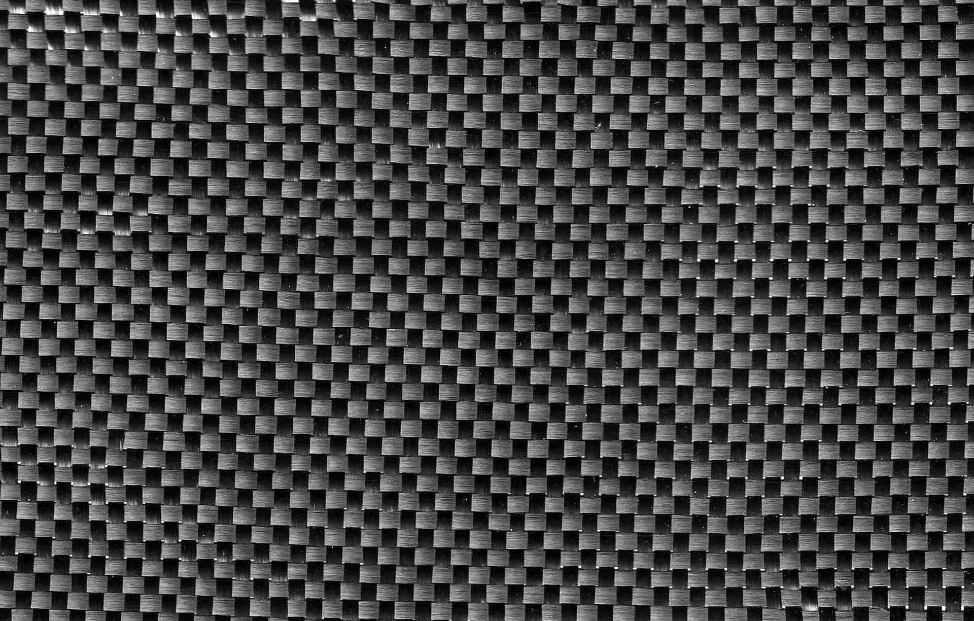 Unveil The Boldness Of Black Carbon Fiber Background