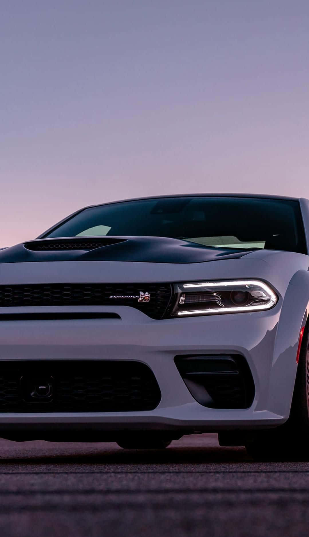 Upgrade Your Technology With This Dodge Charger Iphone Wallpaper Background