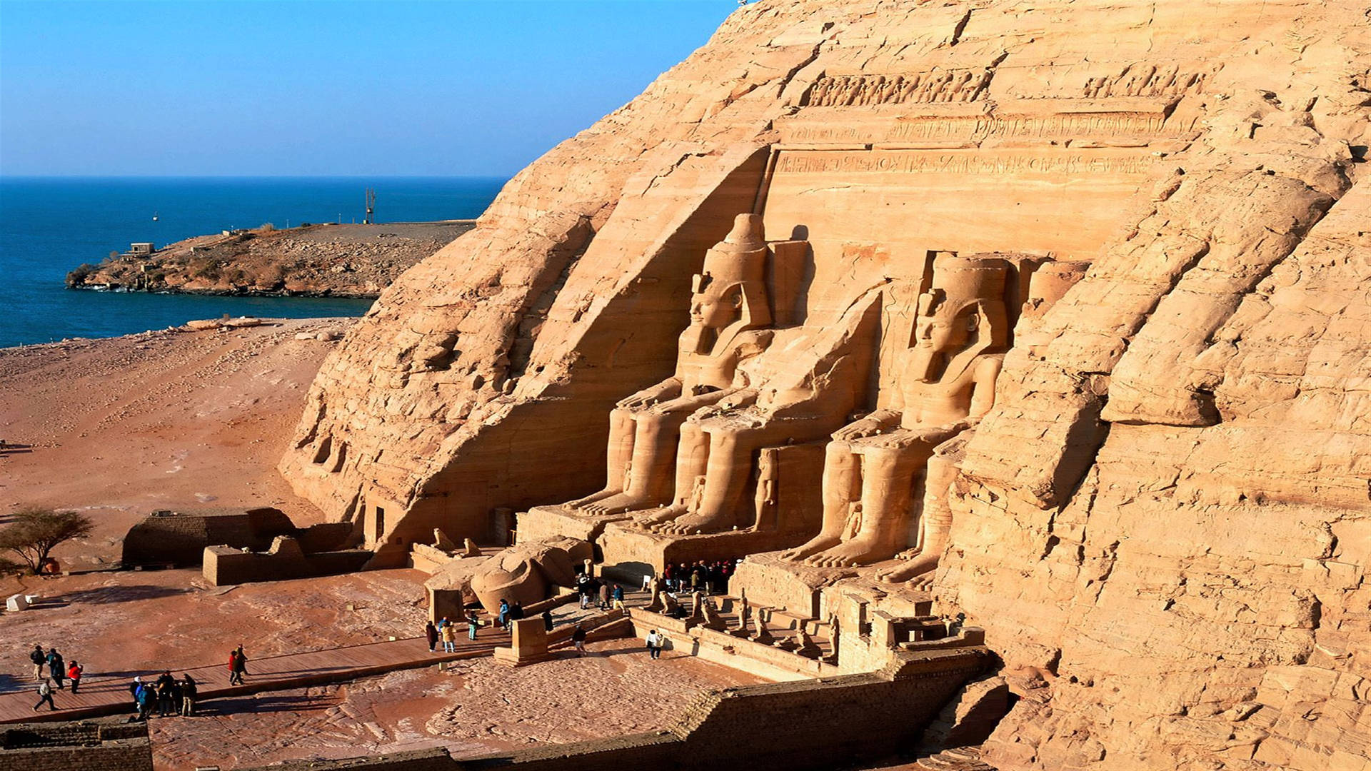 Upper Side Angle Of Ramses The Great Statue In Abu Simbel Background