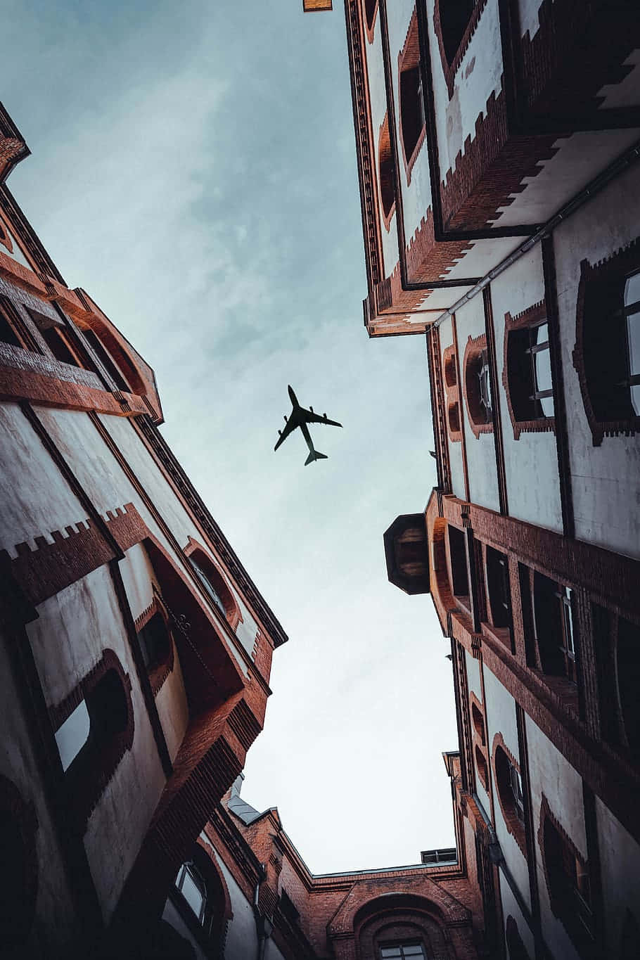 Urban_ Canyon_with_ Airplane_ Above.jpg Background