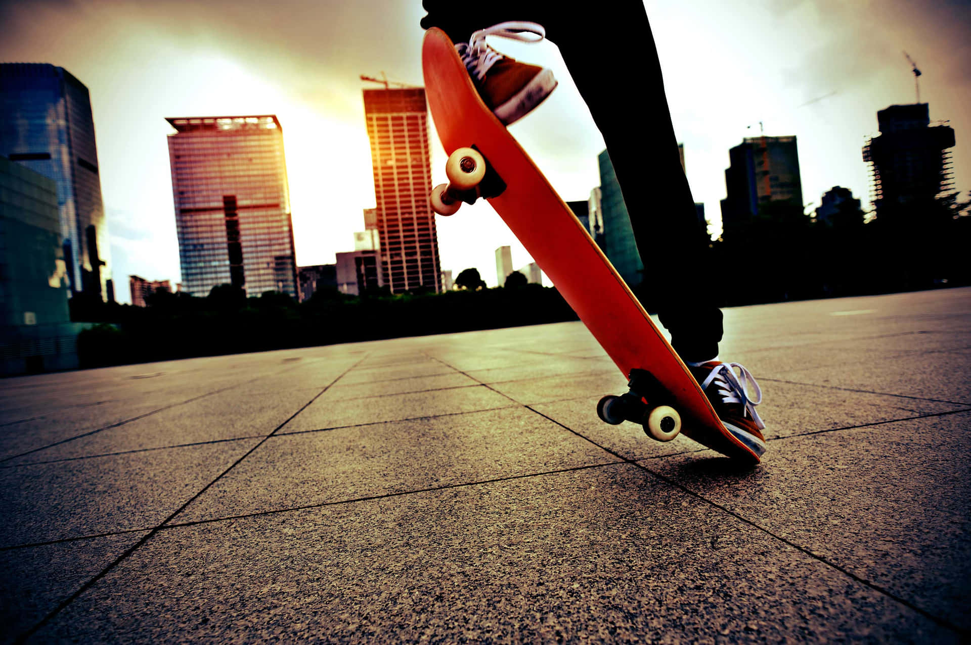 Urban Skateboarding Trick Sunset Background