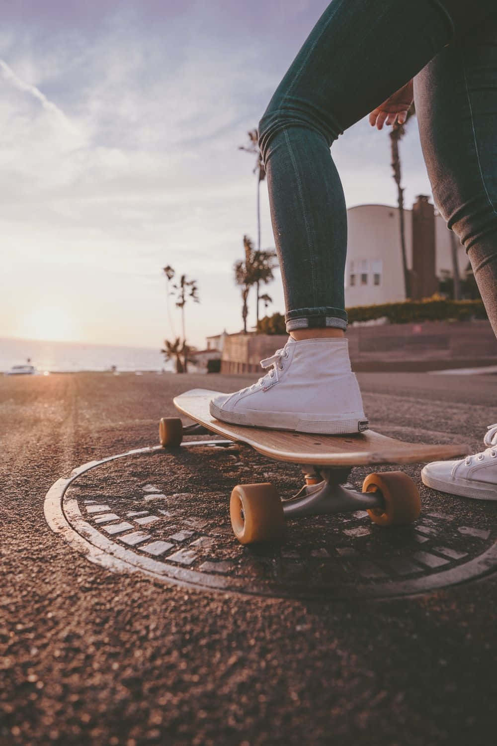 Urban Skateboardingat Sunset Background