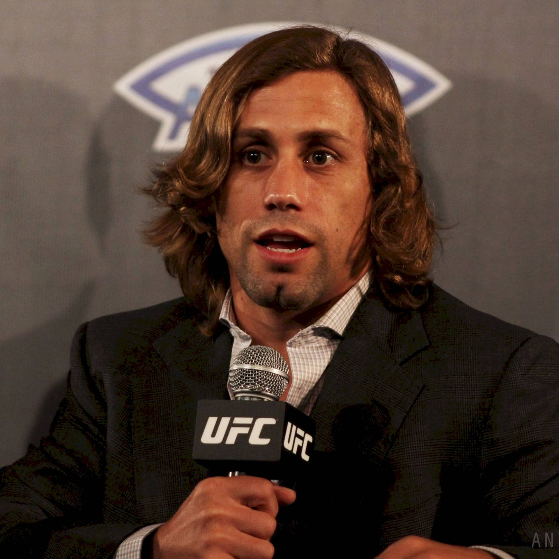 Urijah Faber Holding A Ufc Microphone