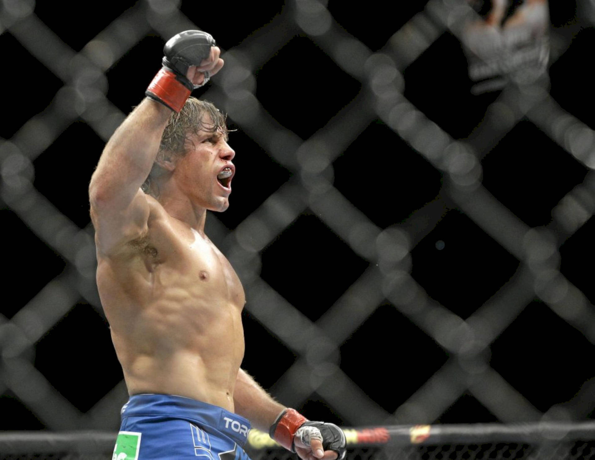 Urijah Faber Yelling And Raising Arm