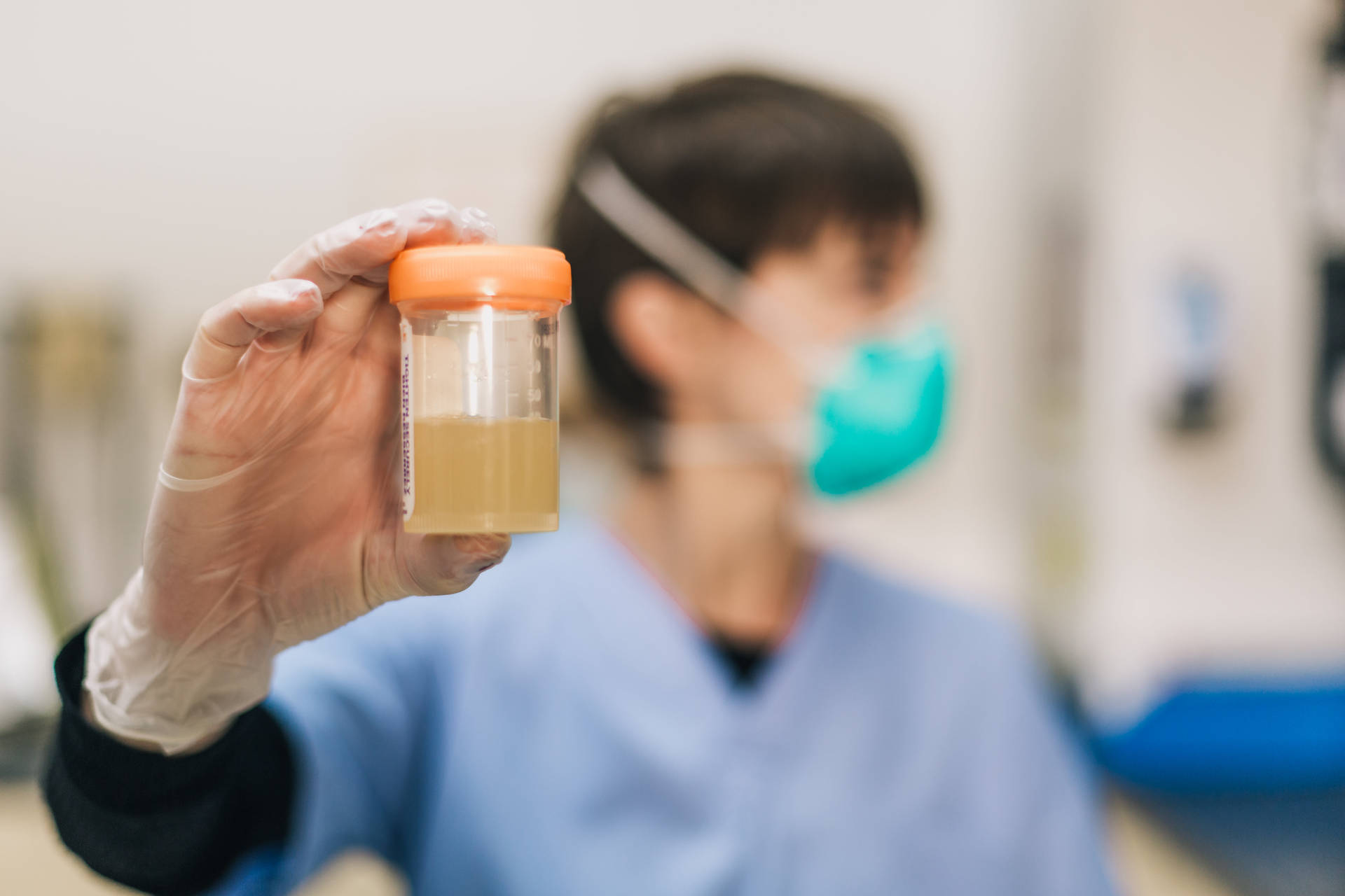 Urine Laboratory Test Sample In Cup Background