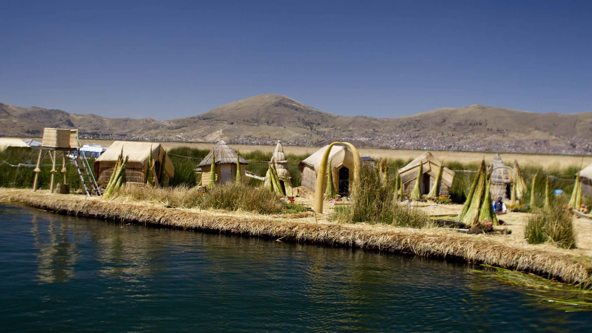 Uru People Huts From Lake Titicaca Background