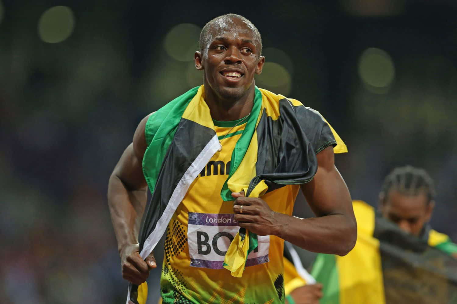 Usain Bolt Jamaican Colors While Running Background