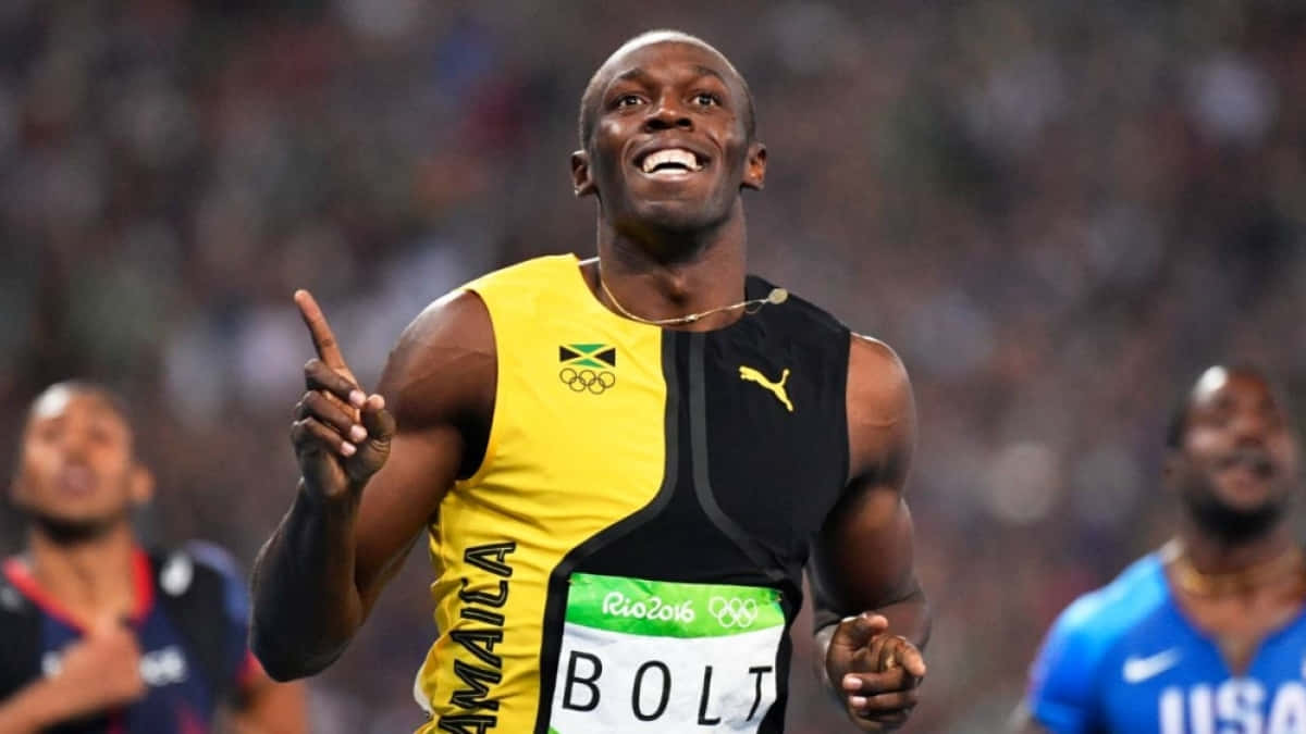 Usain Bolt Smiling And Pointing Up