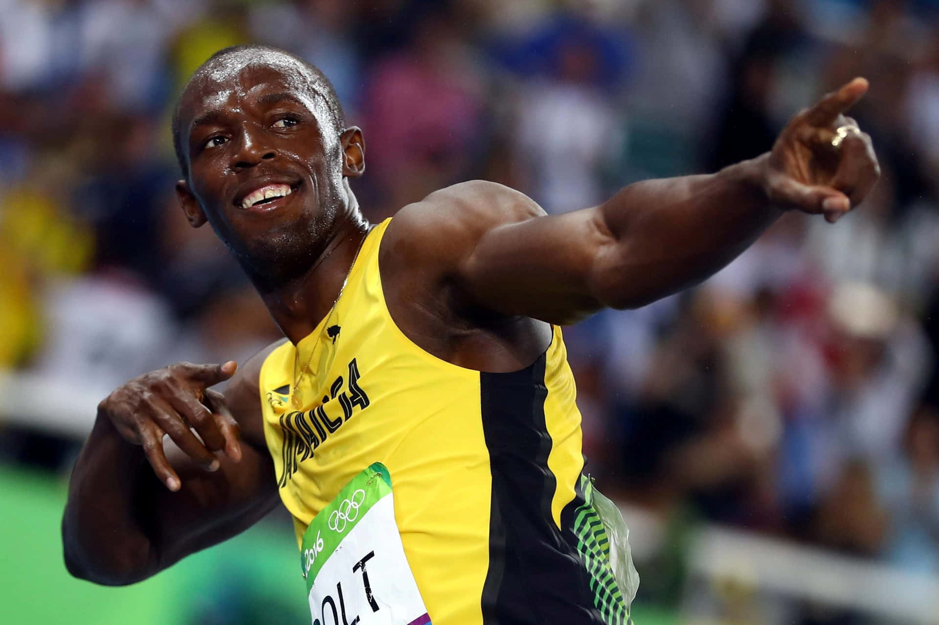 Usain Bolt Smiling Pointing To Right