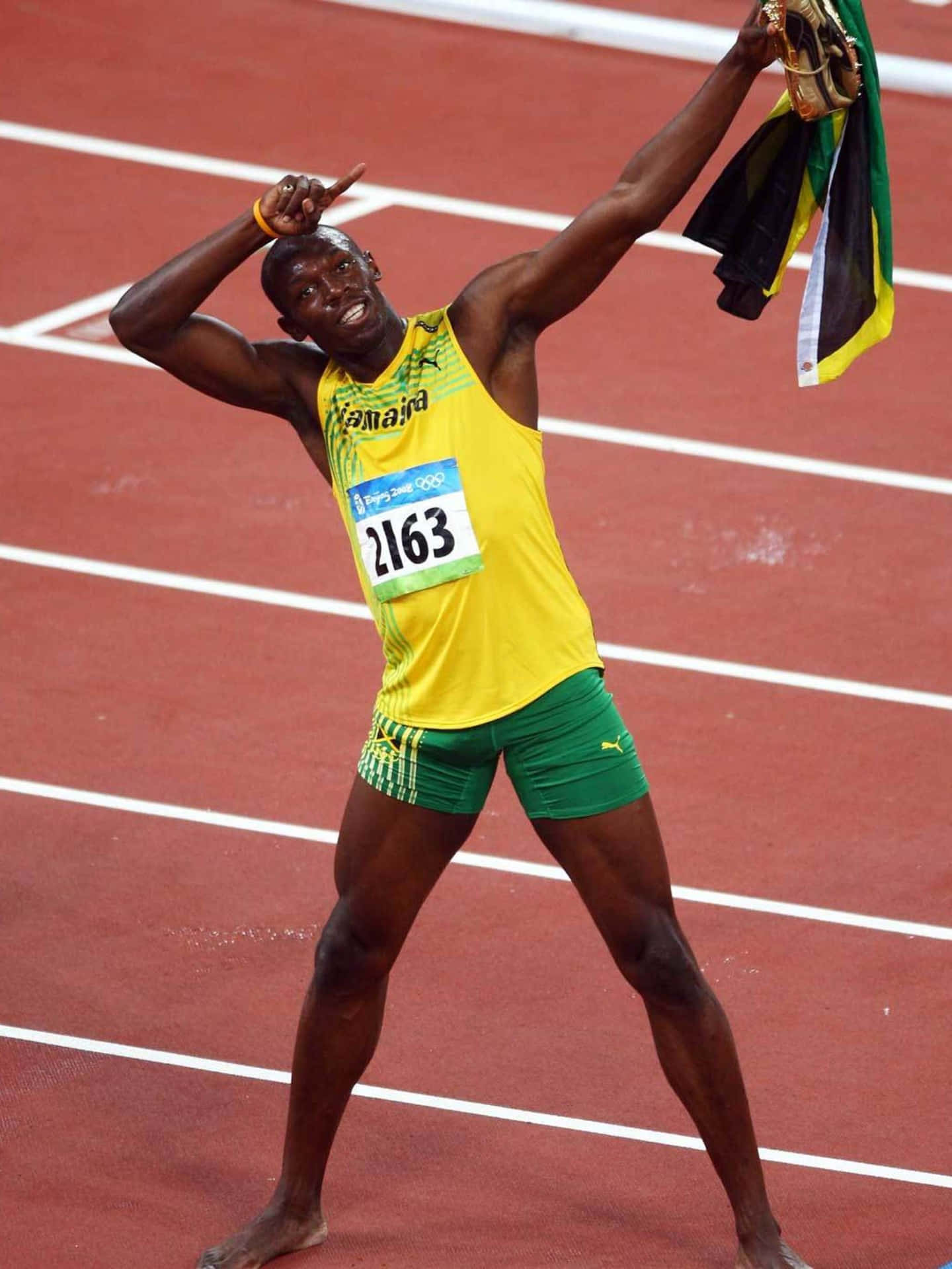 Usain Bolt Strikes Pose On Track Background