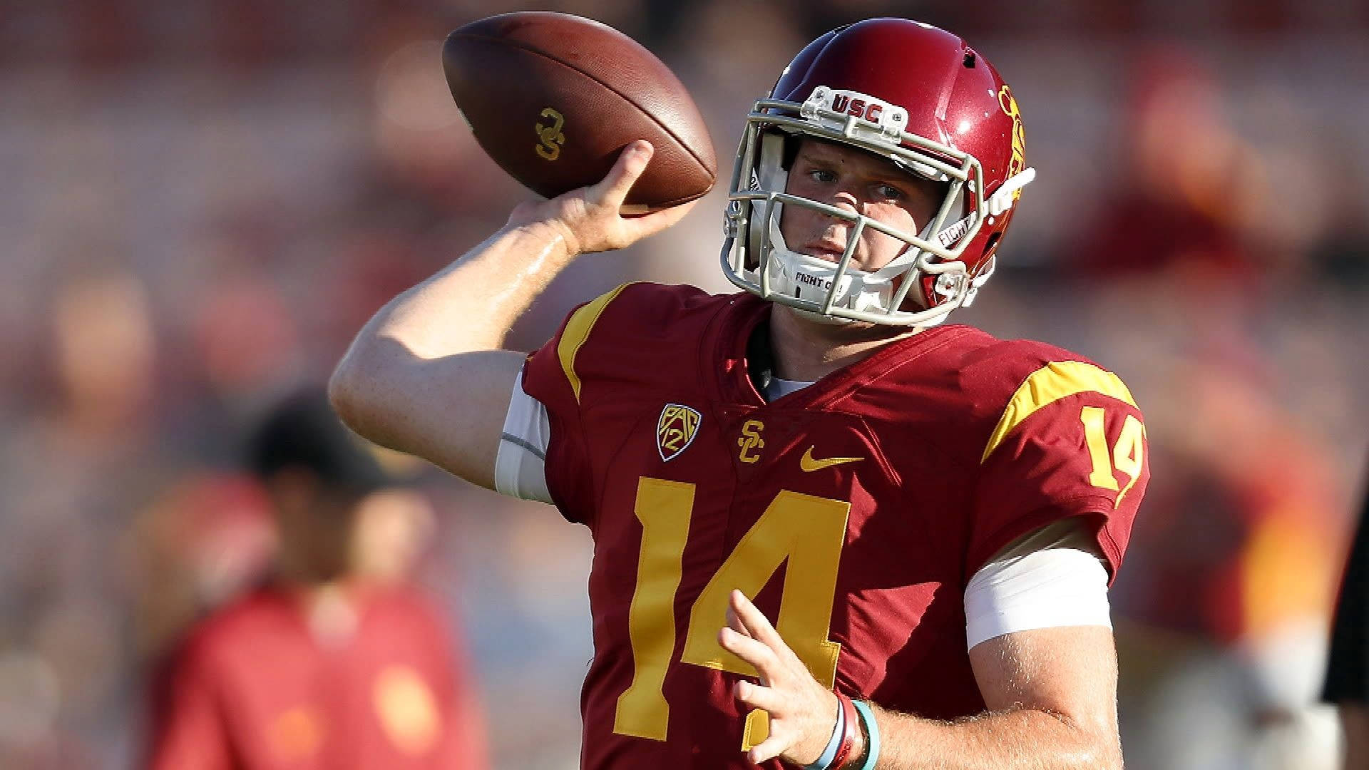 Usc Football Team In Action Background