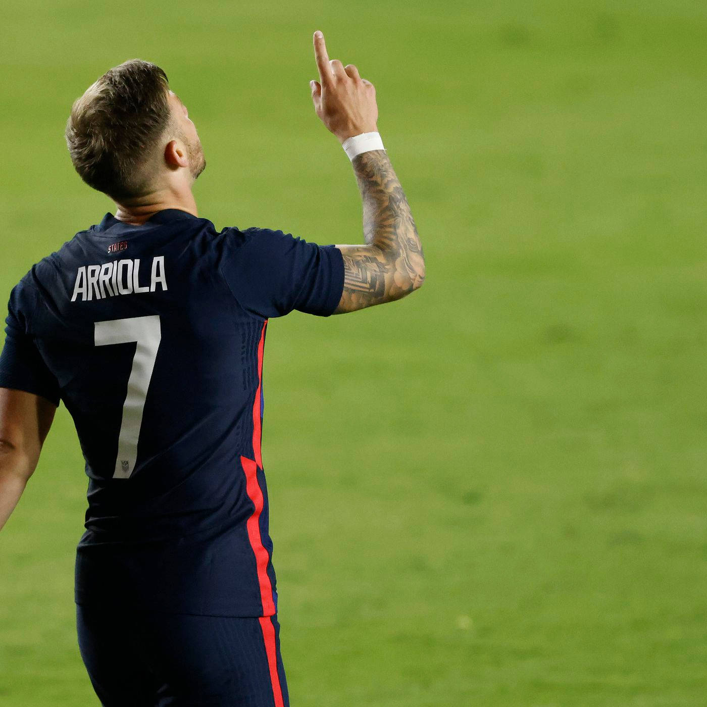 Usmnt Paul Arriola Pointing Towards Sky Grateful Background