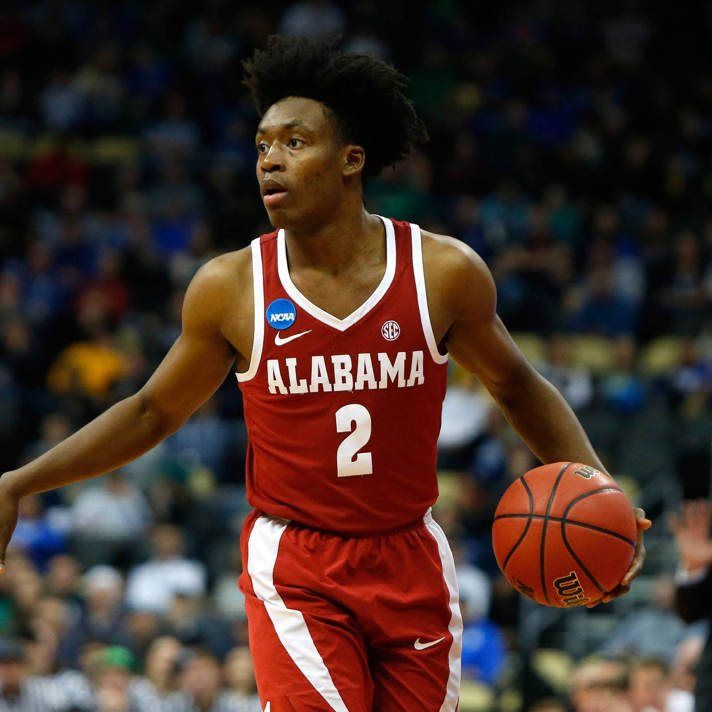 Utah Jazz Basketball Collin Sexton In Red Jersey Background