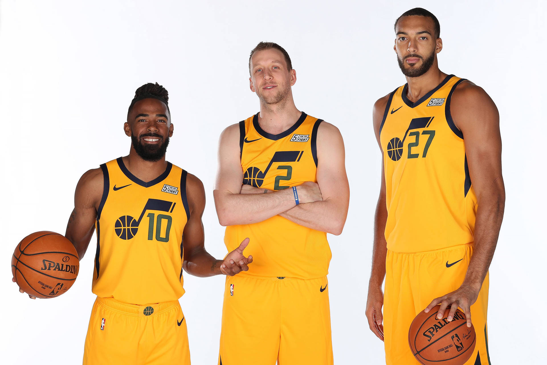 Utah Jazz Players In Yellow Jersey Background