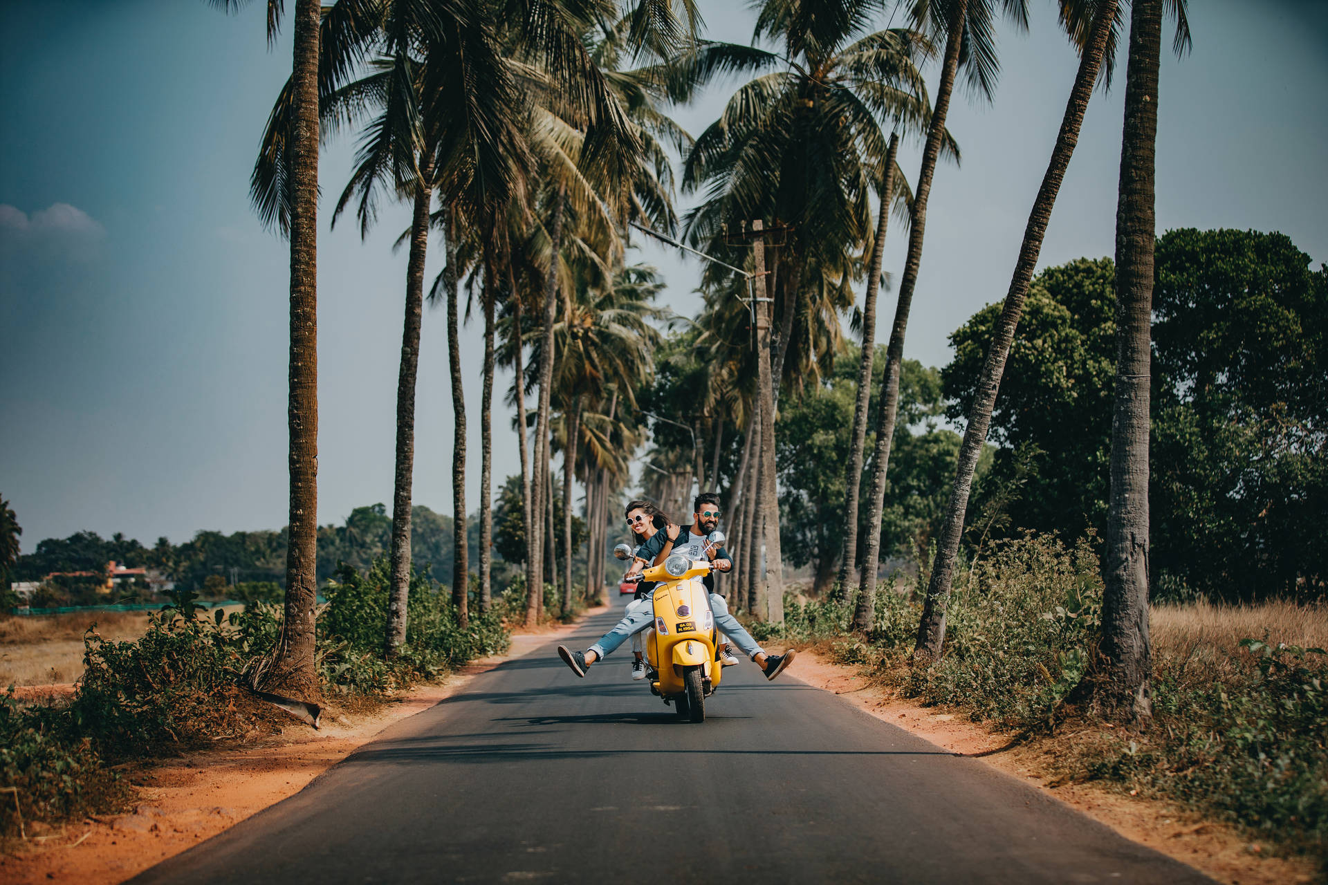 Vacation Couple On Scooter Background