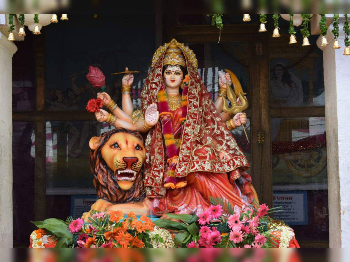 Vaishno Devi Sculpture Sitting On A Lion Background