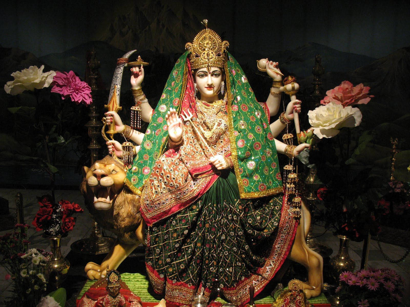 Vaishno Devi Statue Sitting On A Roaring Lion Background