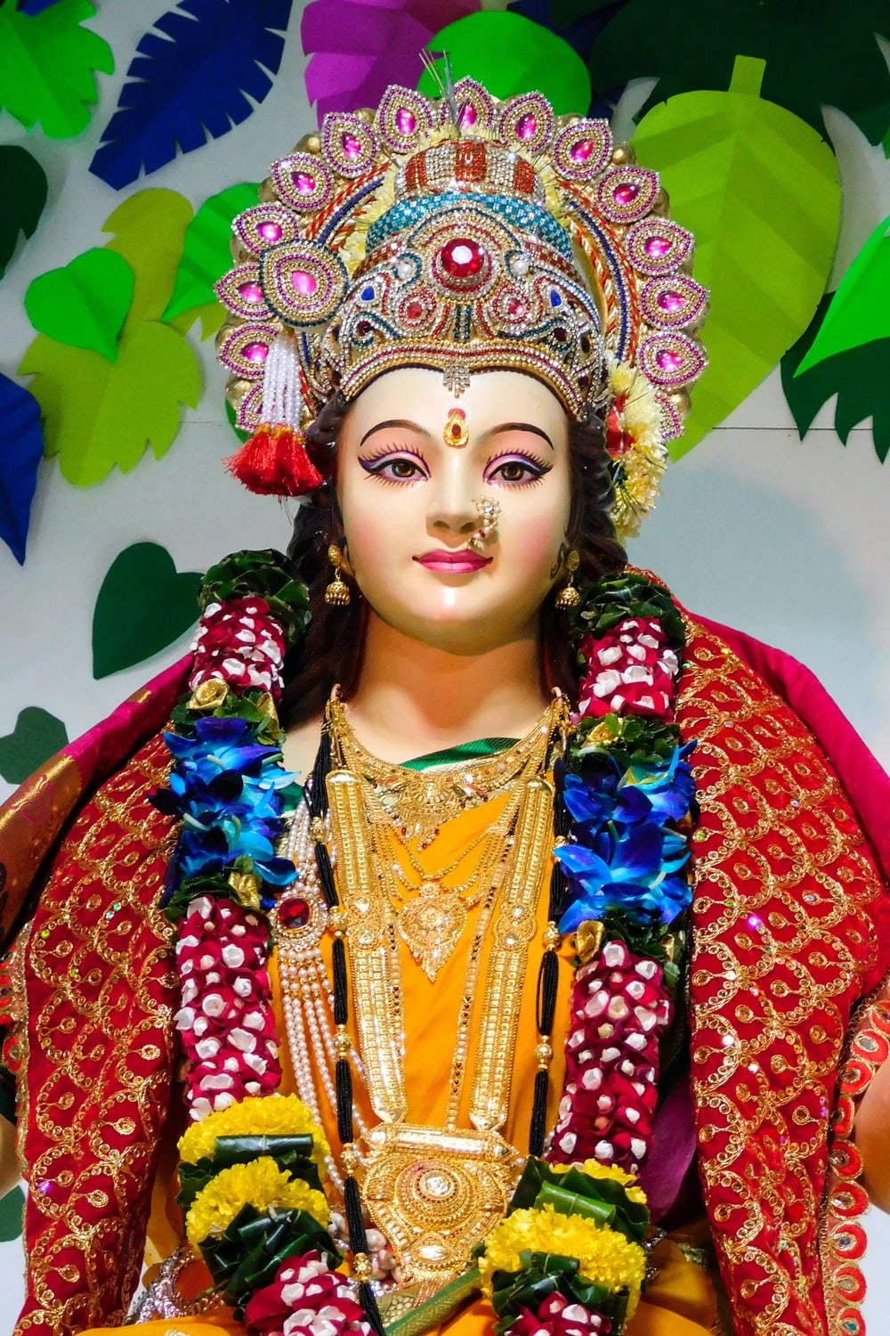 Vaishno Devi Statue Wearing A Red Dupattā Background