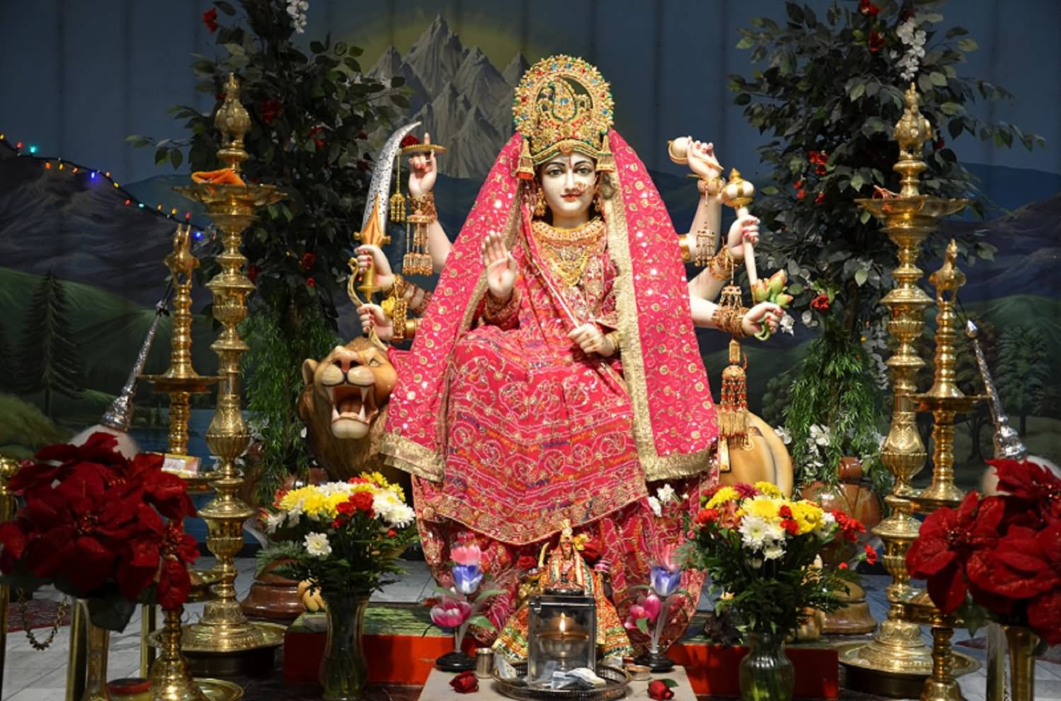 Vaishno Devi Statue Wearing A Red Purdah Background