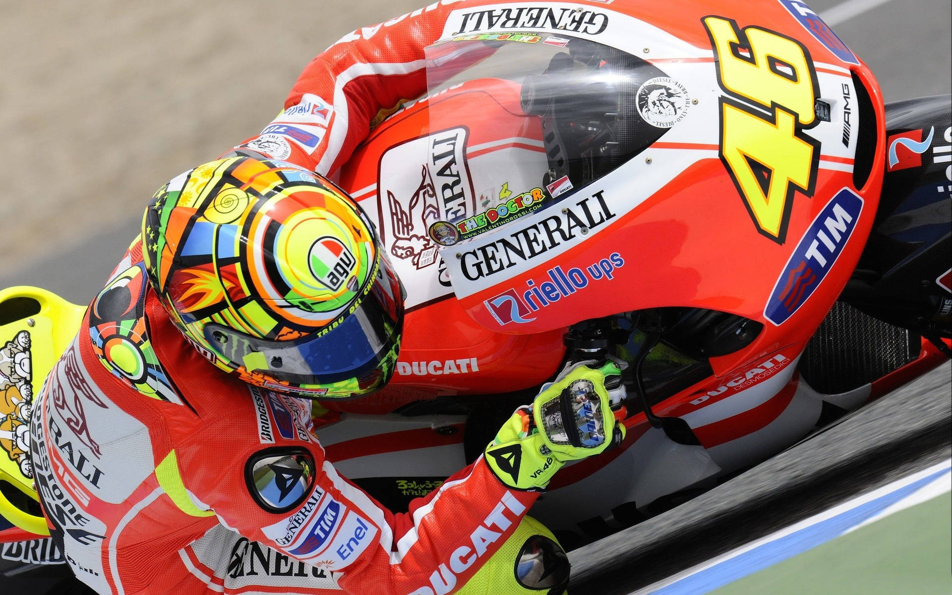 Valentino Rossi - Racer Extraordinaire Riding A Bold Red Ducati Background