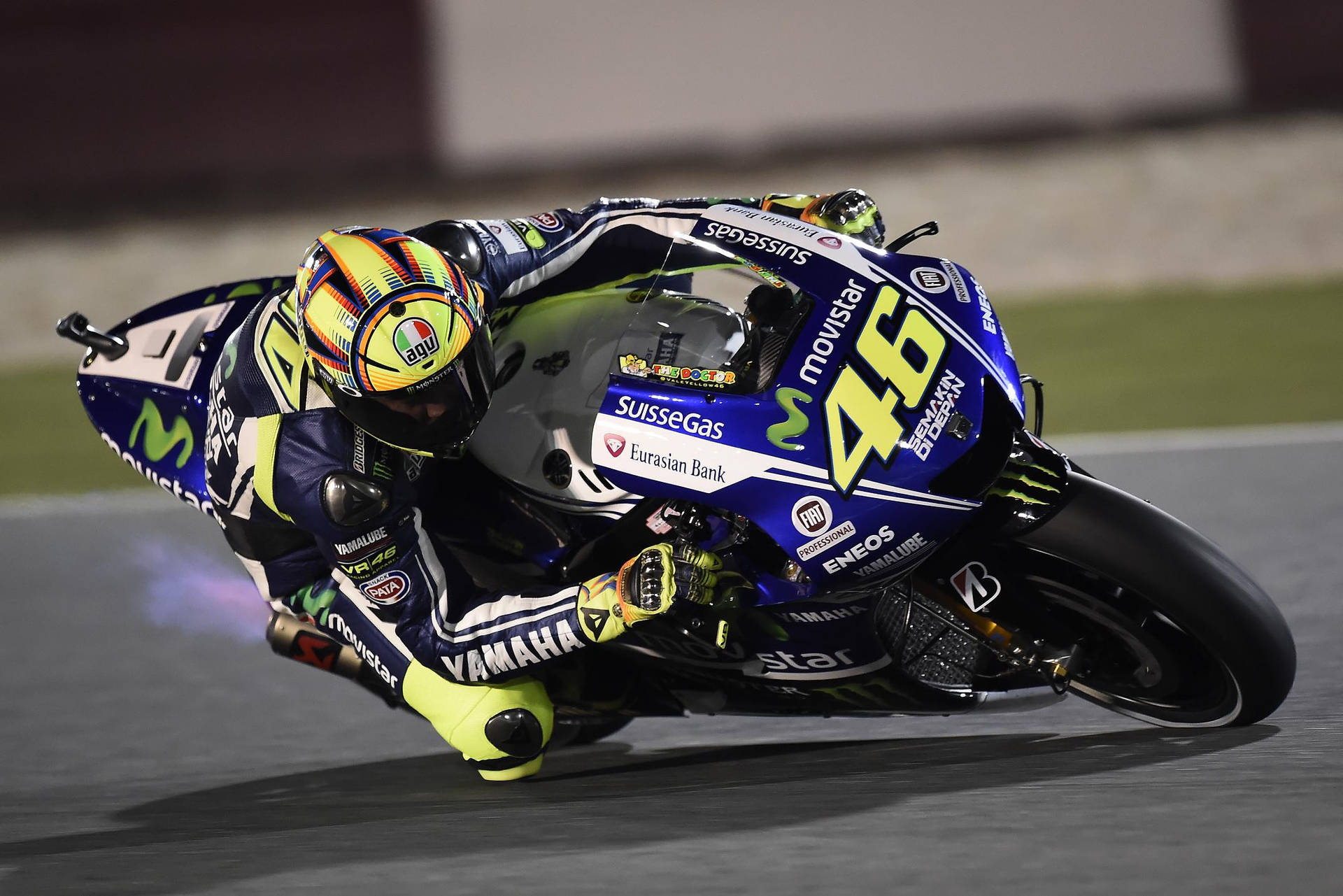 Valentino Rossi, The Legendary Motogp Racer In Action Background