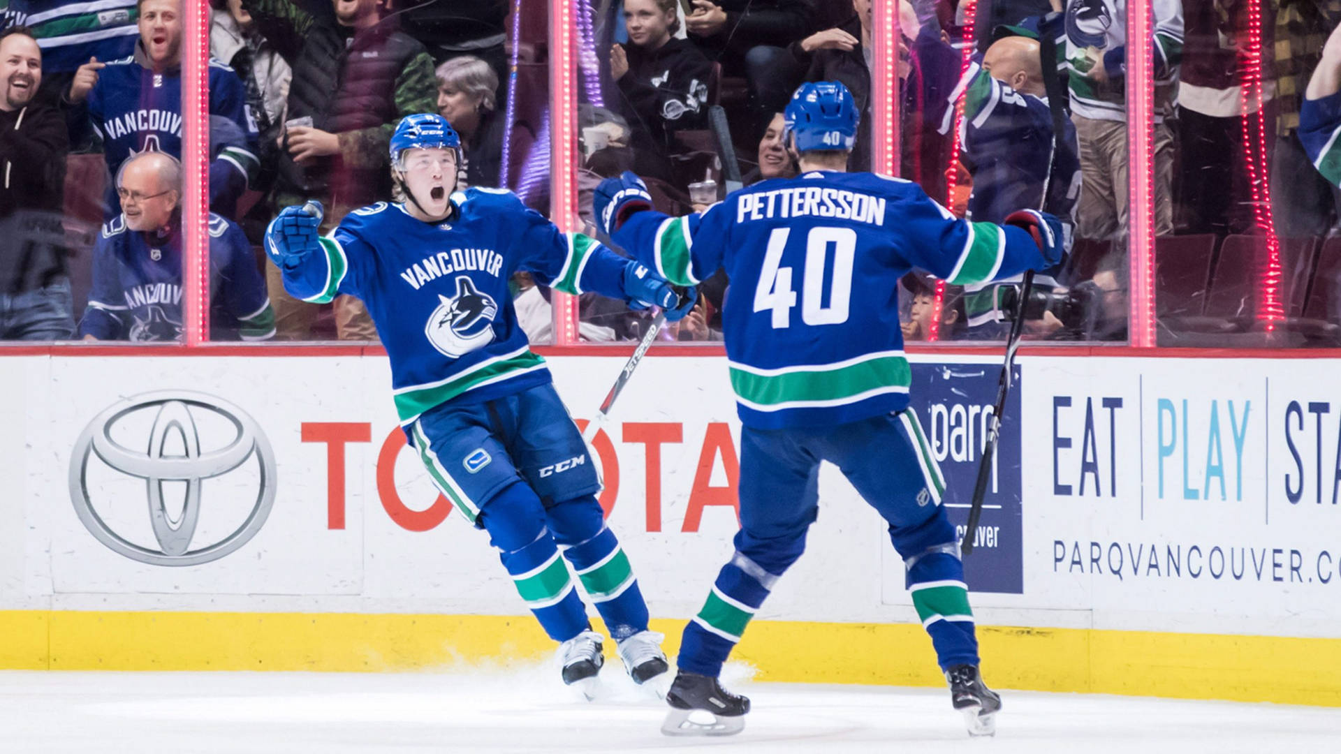 Vancouver Canucks Players Elias Pettersson And Brock Boeser Background