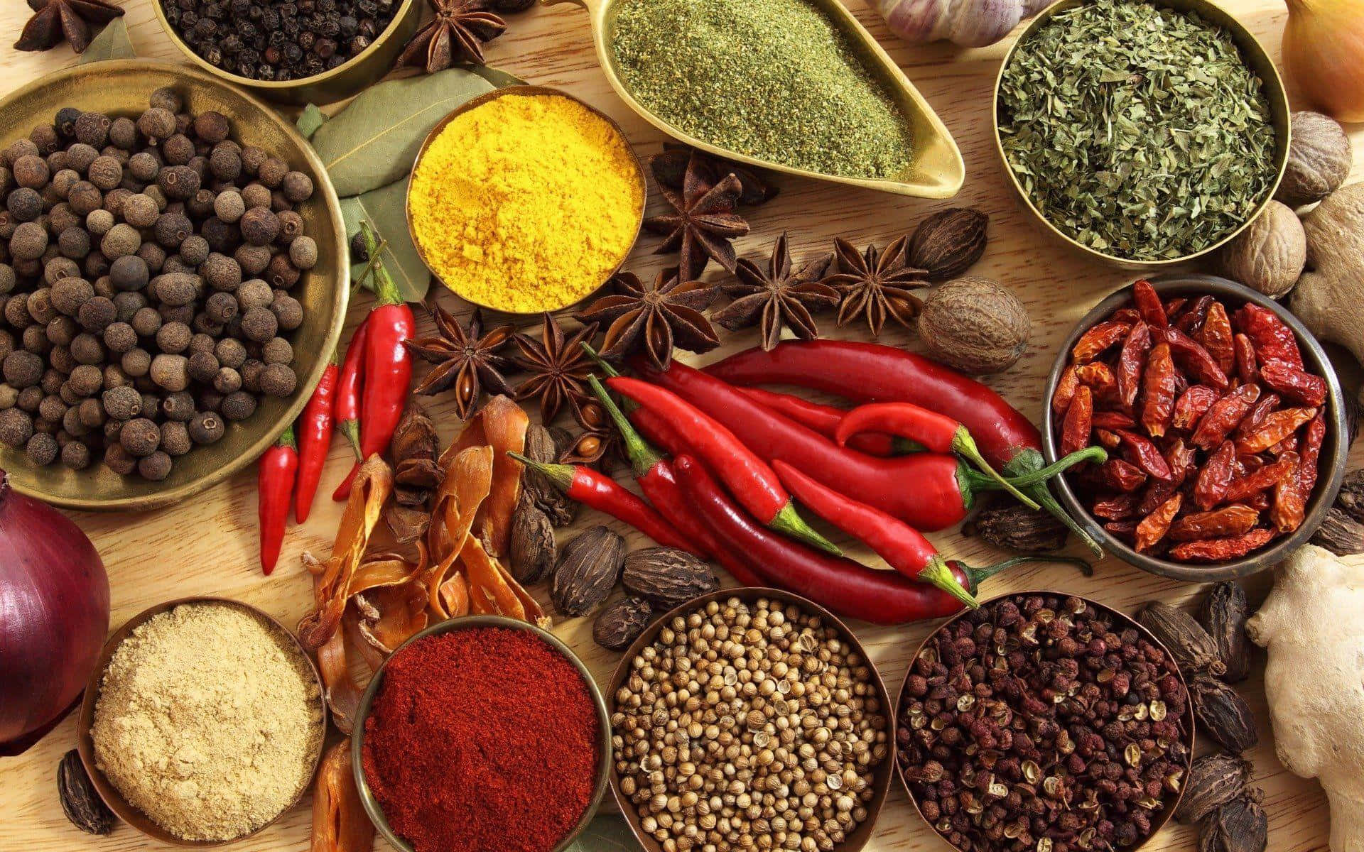 Variety Of Spices On Wooden Table Background