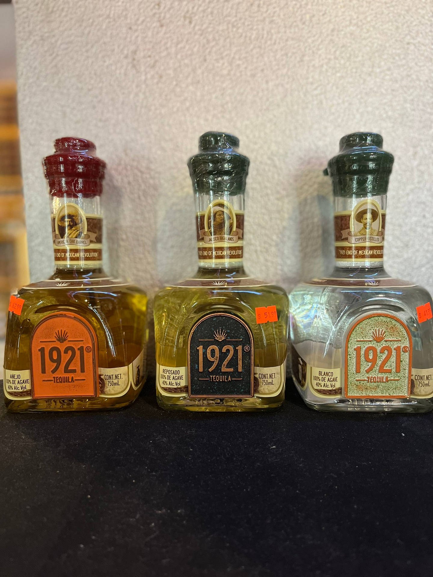 Various 1921 Tequila Bottles Background