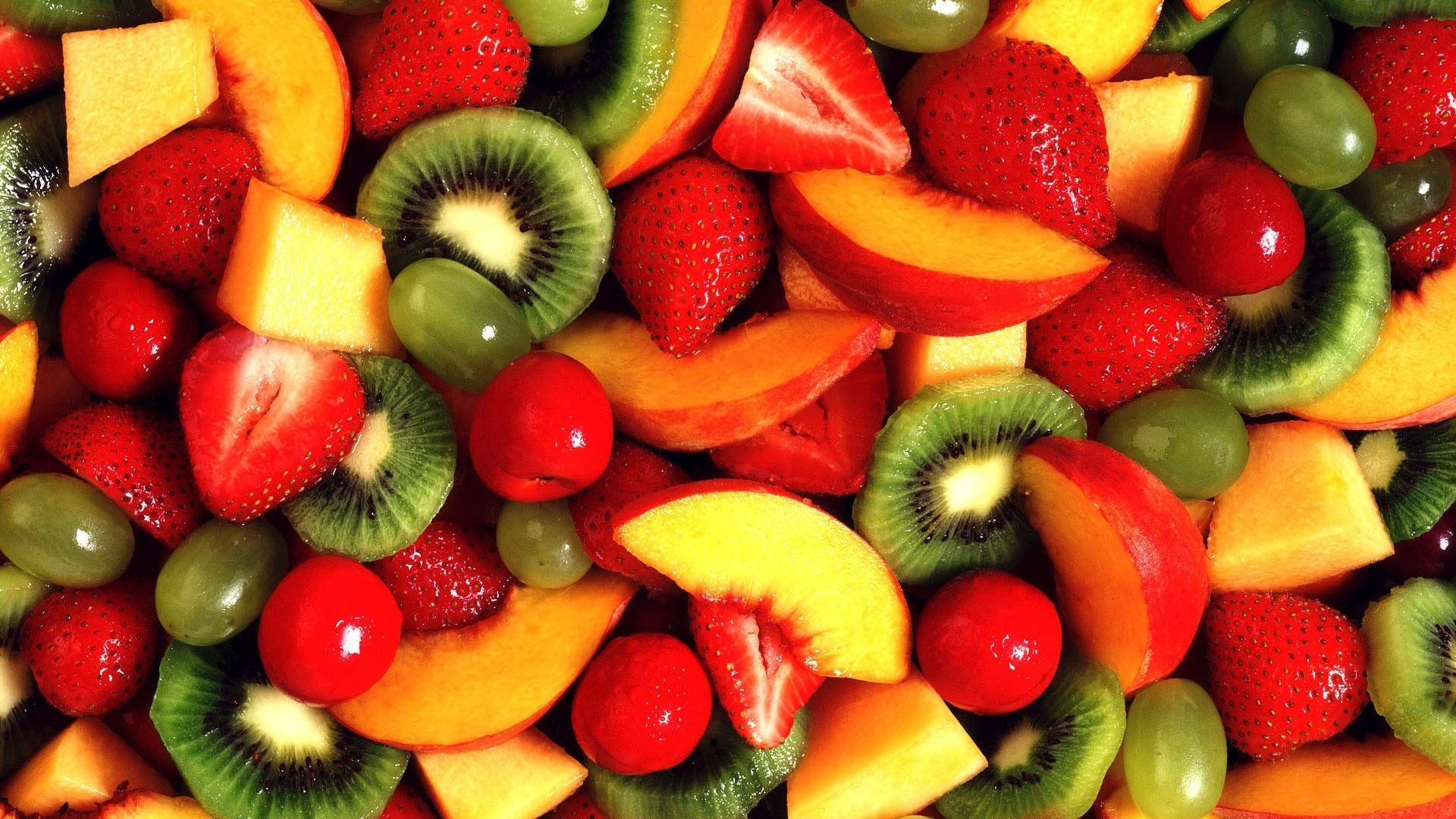 Various Colorful Chopped Fruits Background