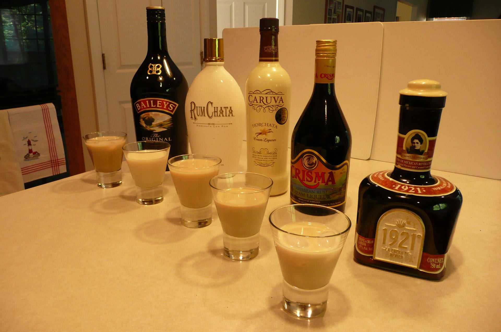 Various Creme Bottles With 1921 Creme De Tequila