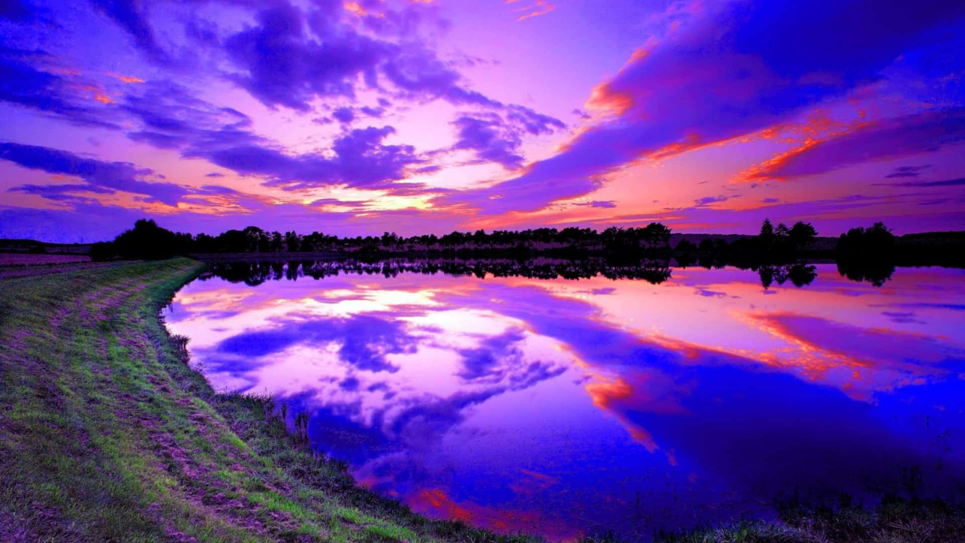 Vast Lake With A Blue And Purple Sunset Background