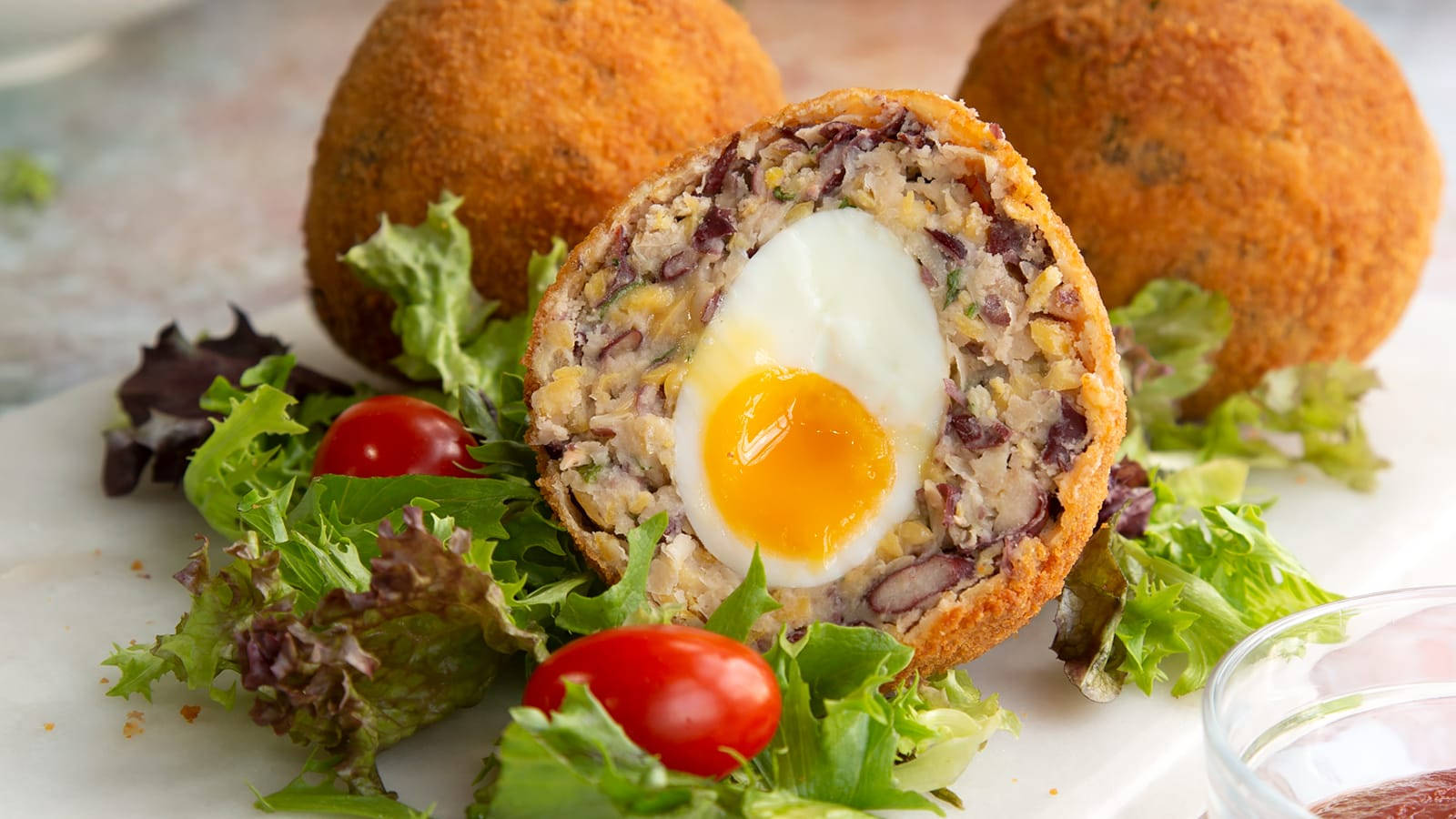 Vegetarian Traditional British Scotch Eggs Dish With Lettuce Background