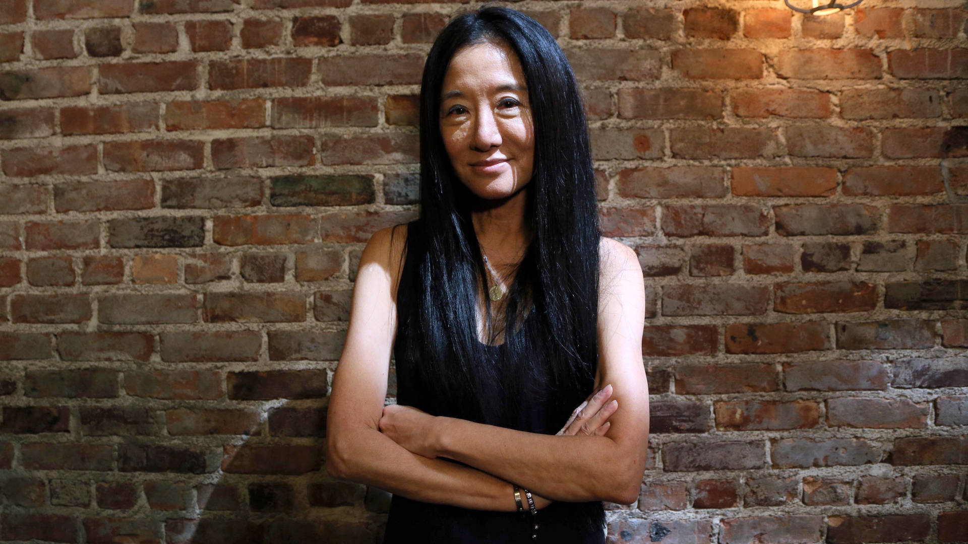 Vera Wang On Brick Wall Backdrop