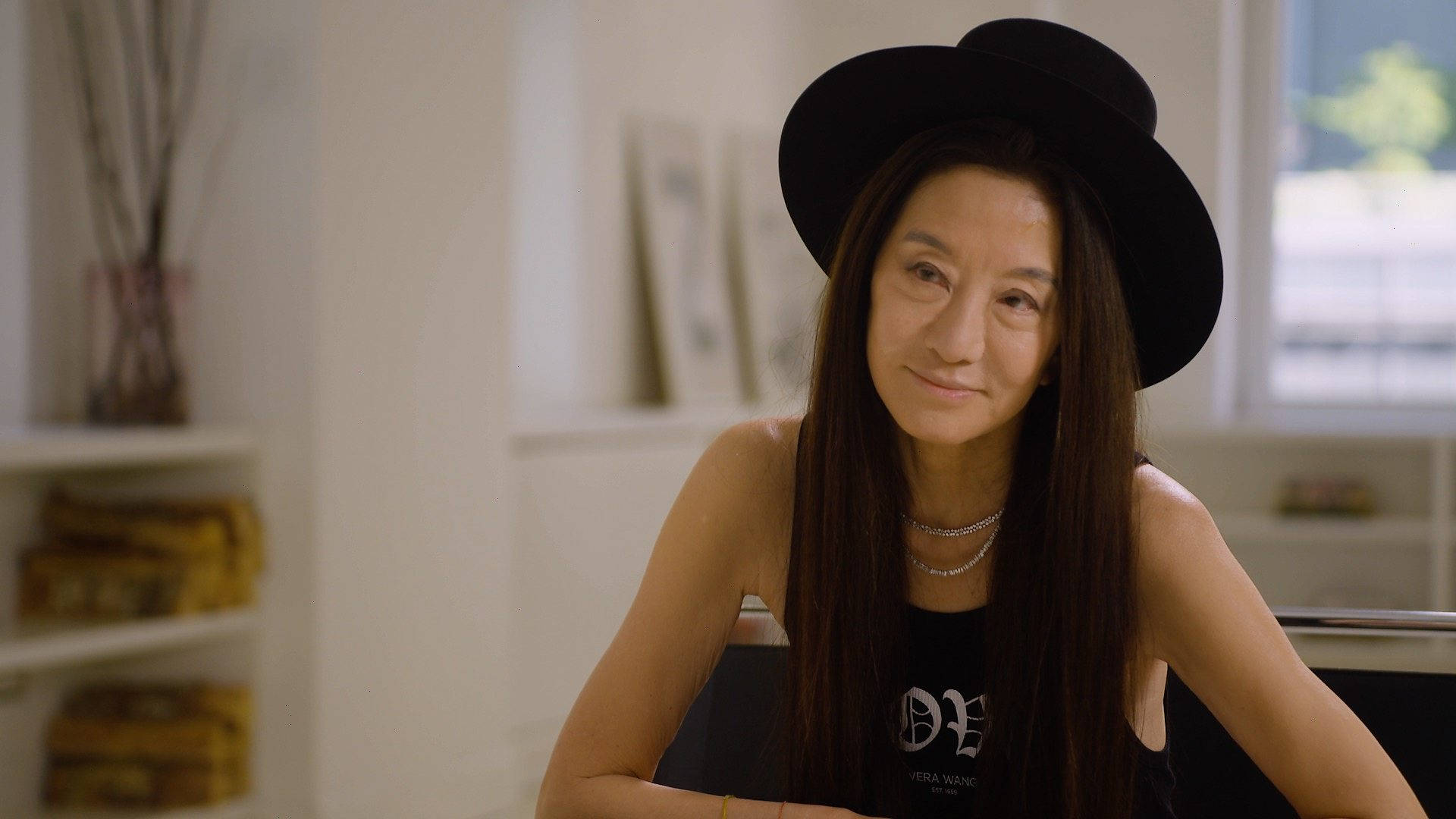 Vera Wang Wearing Black Hat Background